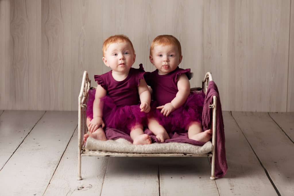 baby twins in vintage cot