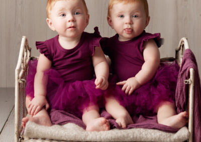 baby twins in vintage cot